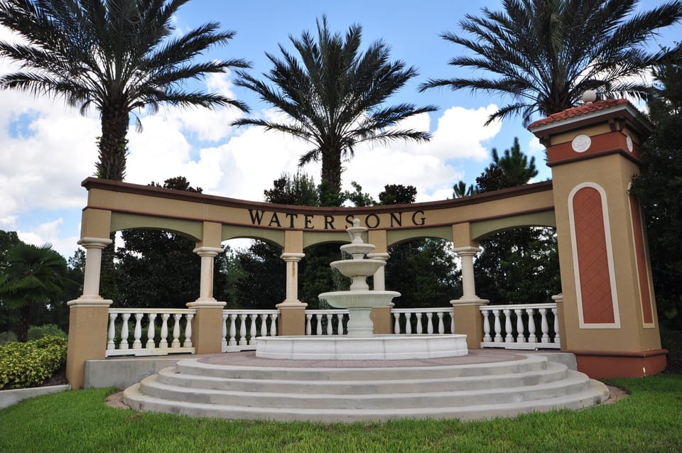 Front entrance to Watersong gated community set in lush conservation area. 