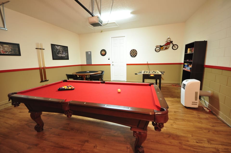Game Room with Pool Table, Foosball, Games table , and electric darts. electric 