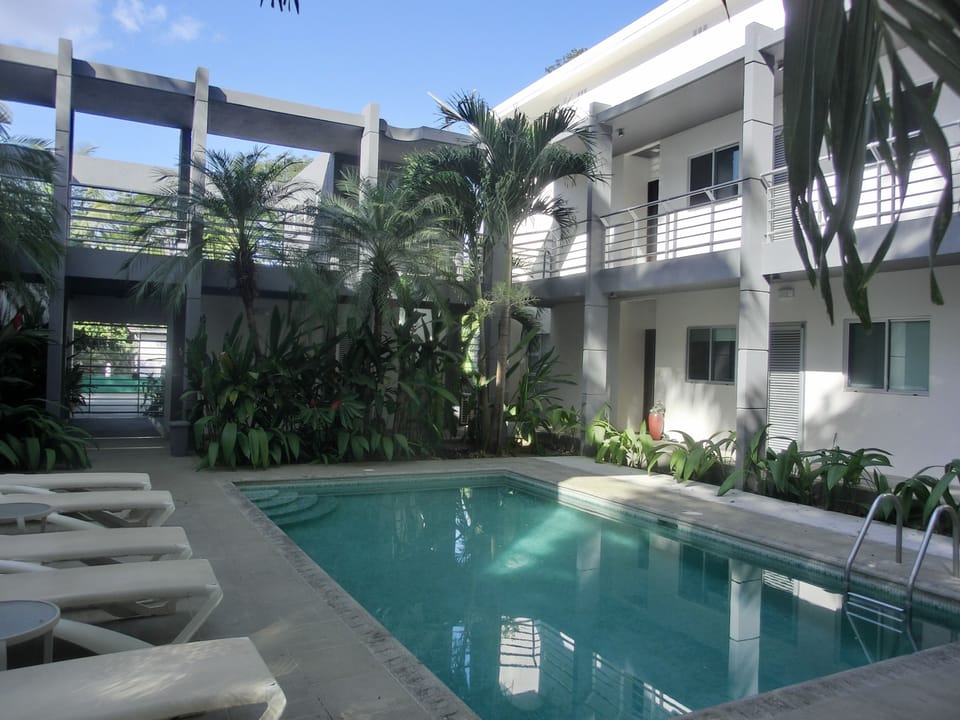 Beautiful, clean, sparkling pool with ample seating | Outdoor shower/restroom