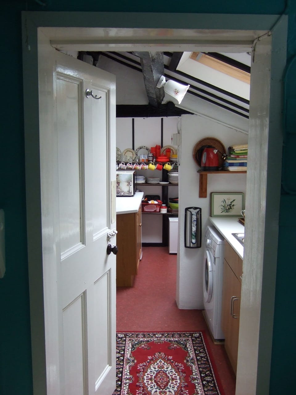 Kitchen view [b] Two small steps down to utility side of kitchen.