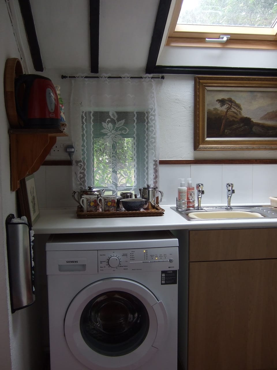 Kitchen view [c]. All essentials provided for your laundry.