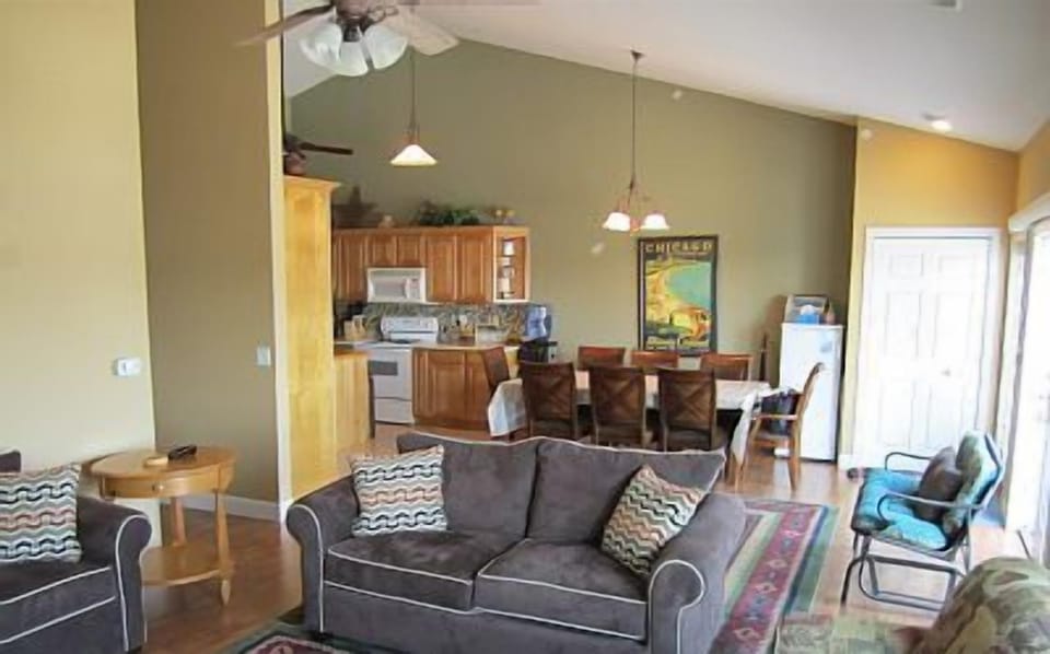 Open concept living area with multiple accesses to balcony.