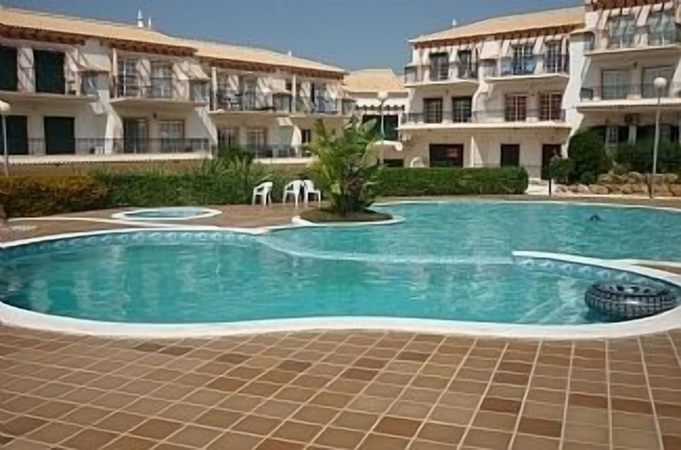 pool area and condominium