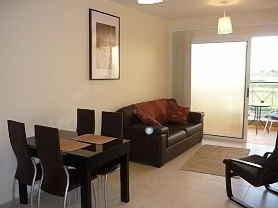 Lounge/diner, leading to spacious balcony.