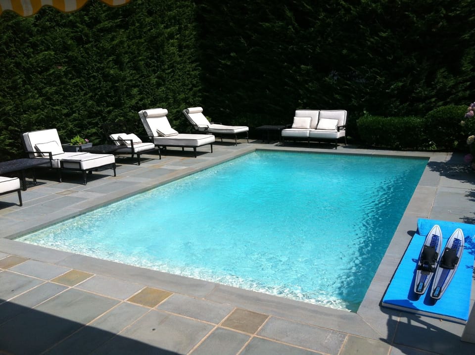 Backyard with pool and lounge chairs
