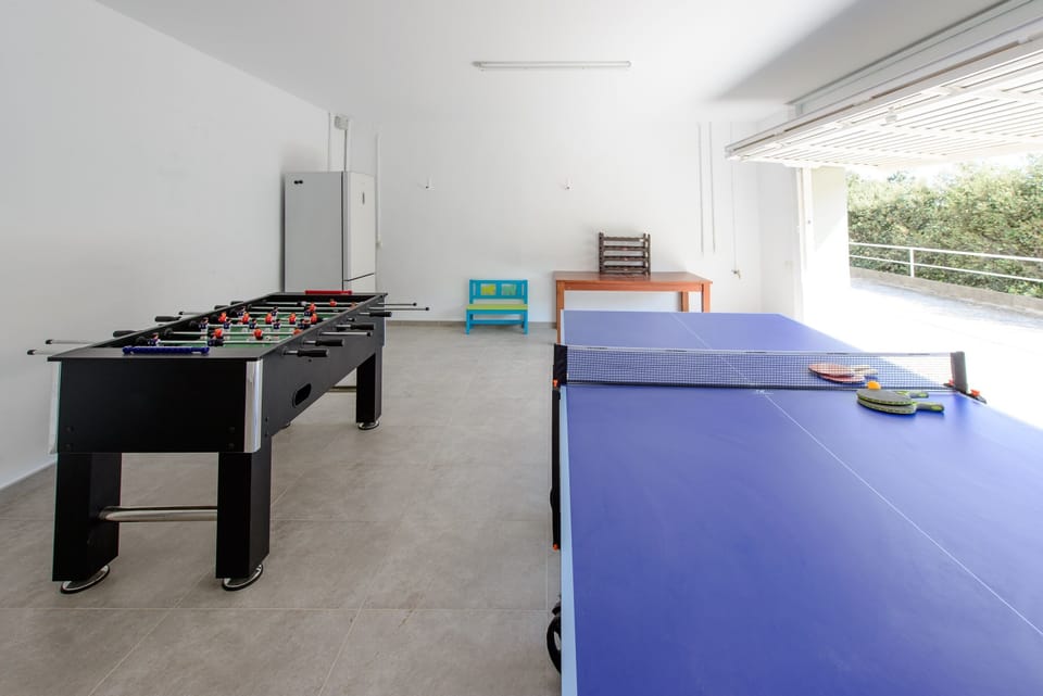Games room with table tennis and table football. We also have another fridge/freezer here for drinks