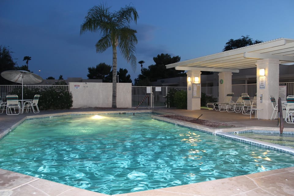 pool at night- heated with hot tub