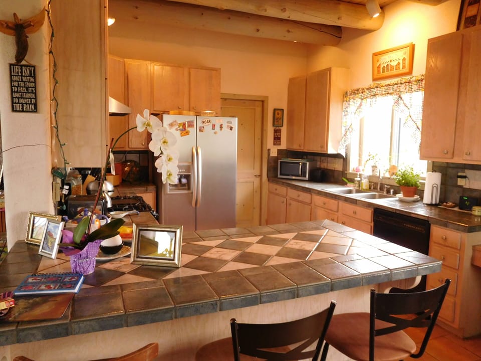 Spacious well appointed kitchen w/ breakfast bar; good computer work station.