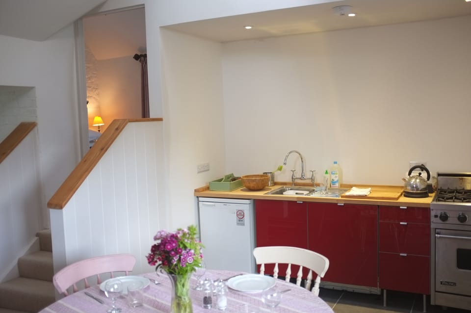 Kitchen, and steps up to ensuite bedroom