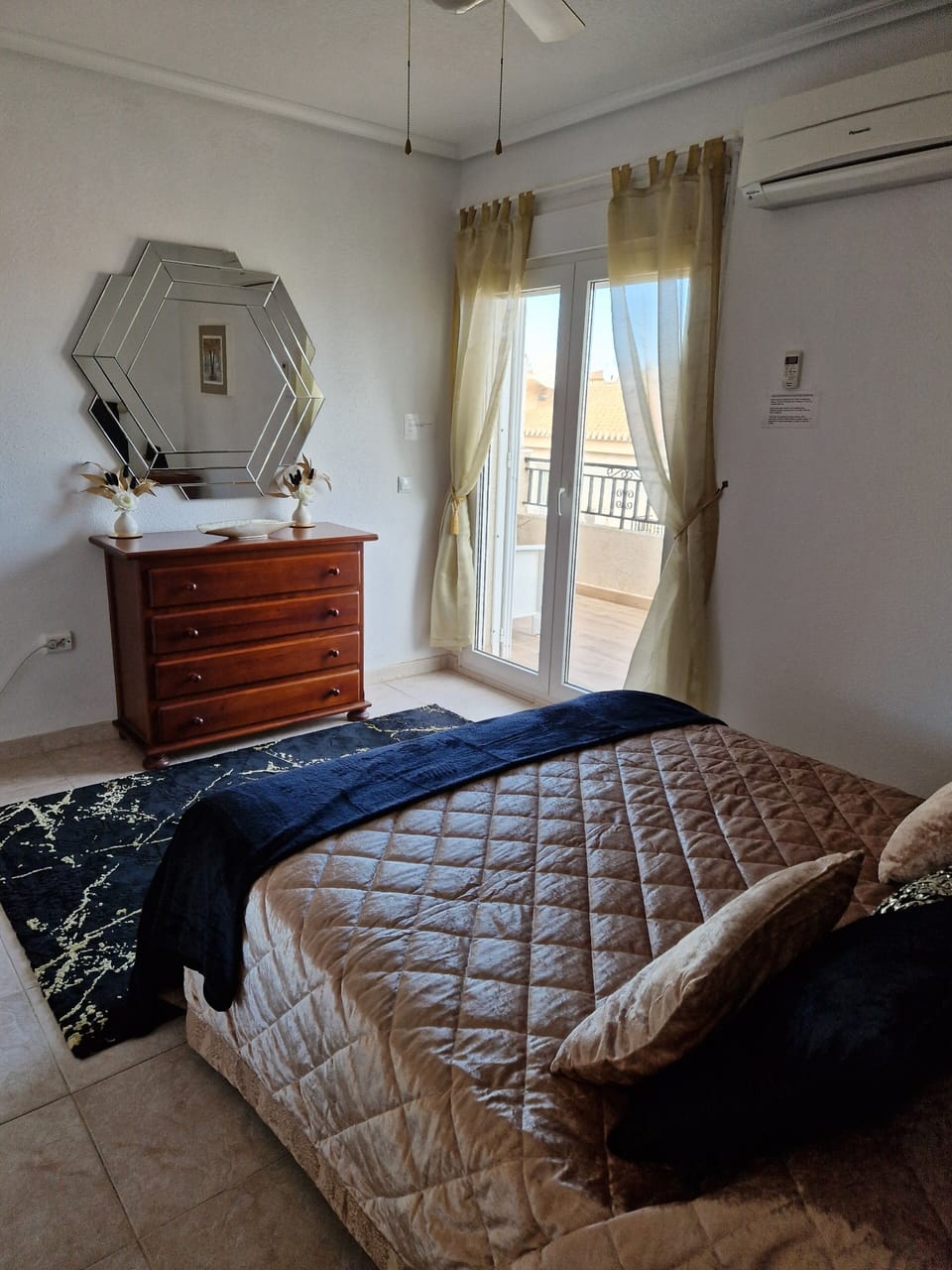 Master bedroom with doors to balcony