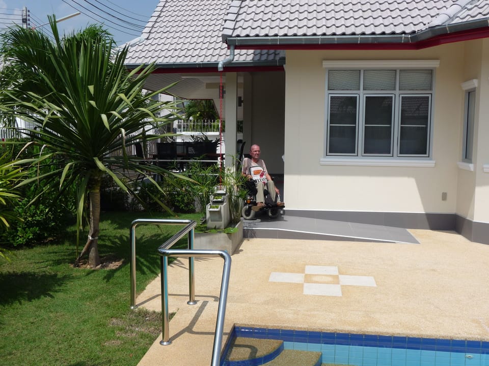 One of my guests coming down to the pool area. He likes the sun, doesn't swim.