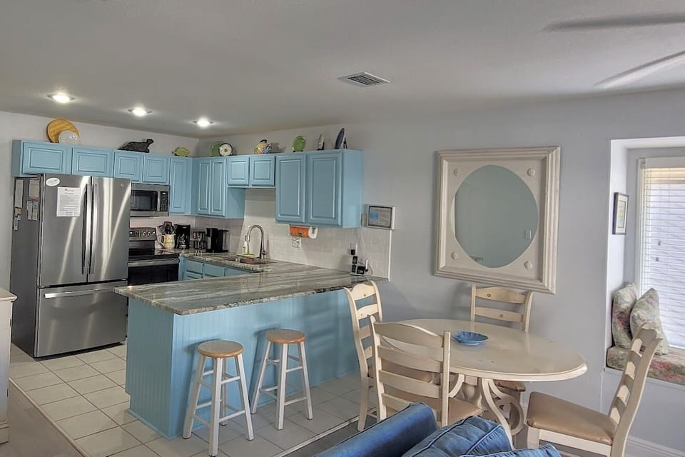 Table and breakfast bar for dining on the main level