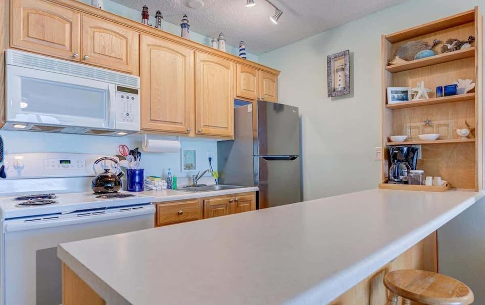 This condo features a full kitchen