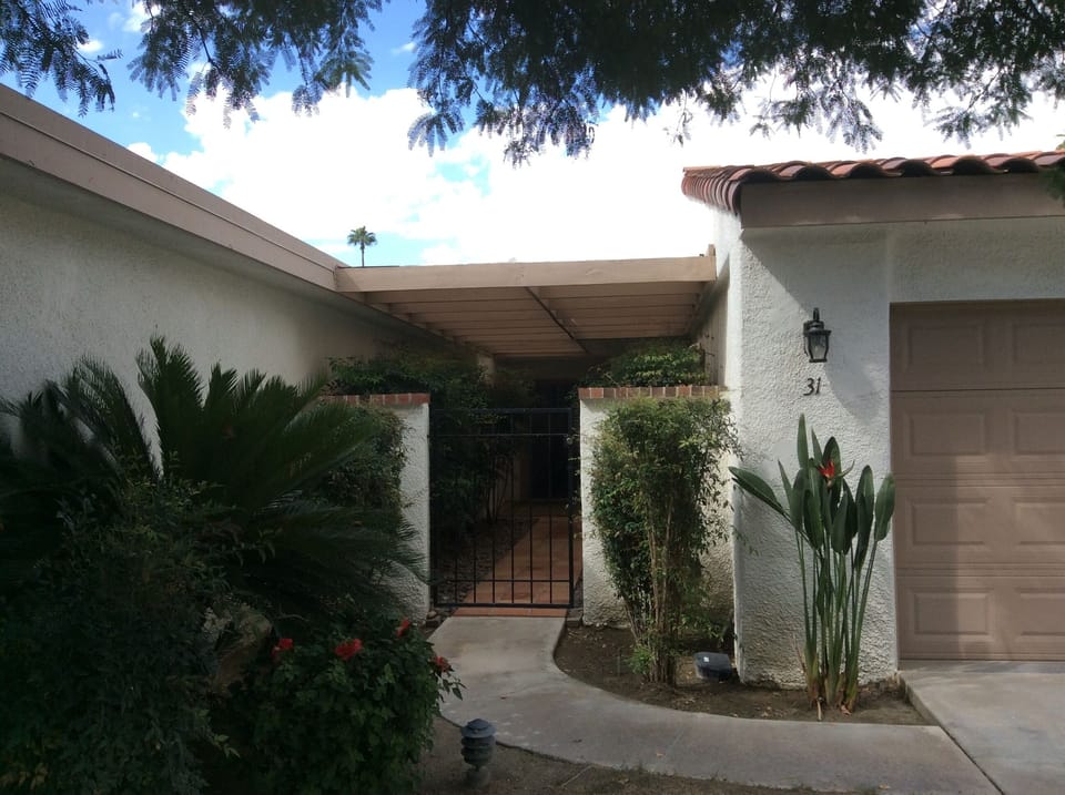 Front entry courtyard off 2 car garage