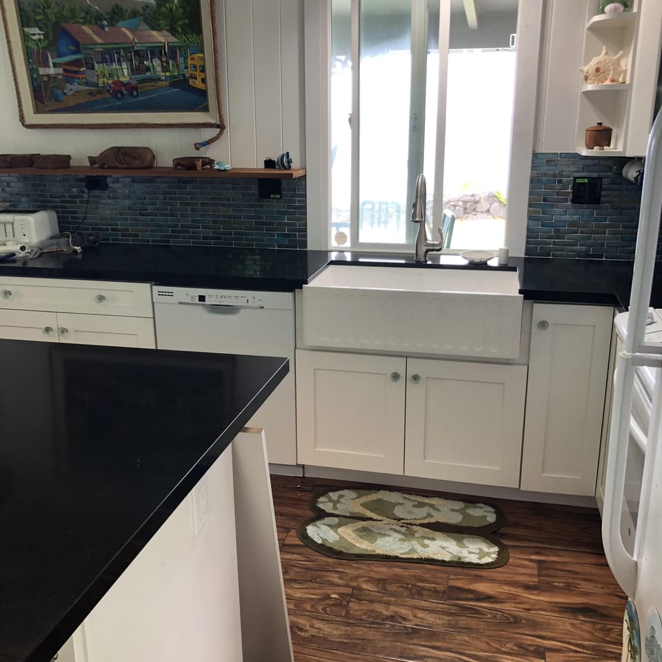 farmhouse kitchen sink with view of the ocean