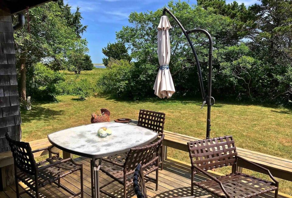 Deck eating area with view of the pond