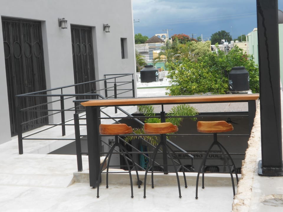 Have a snack, glass of wine or view the lit up city from the bar