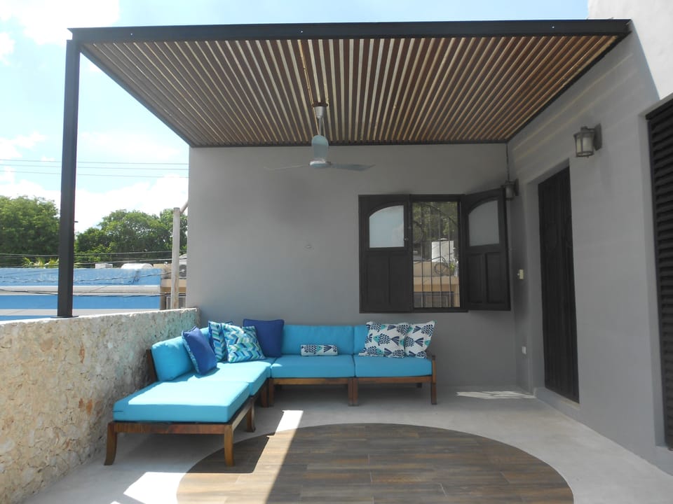 Lounge in the deep cushioned lounge sectional or the hammock.