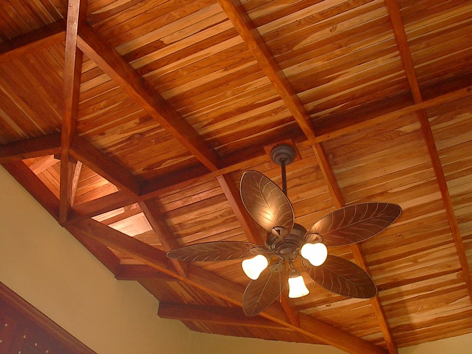 The property's distinctive style features tall vaulted wood ceilings.