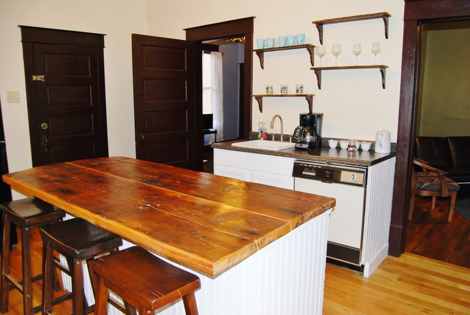 The kitchen island, made from early 1900 boards.