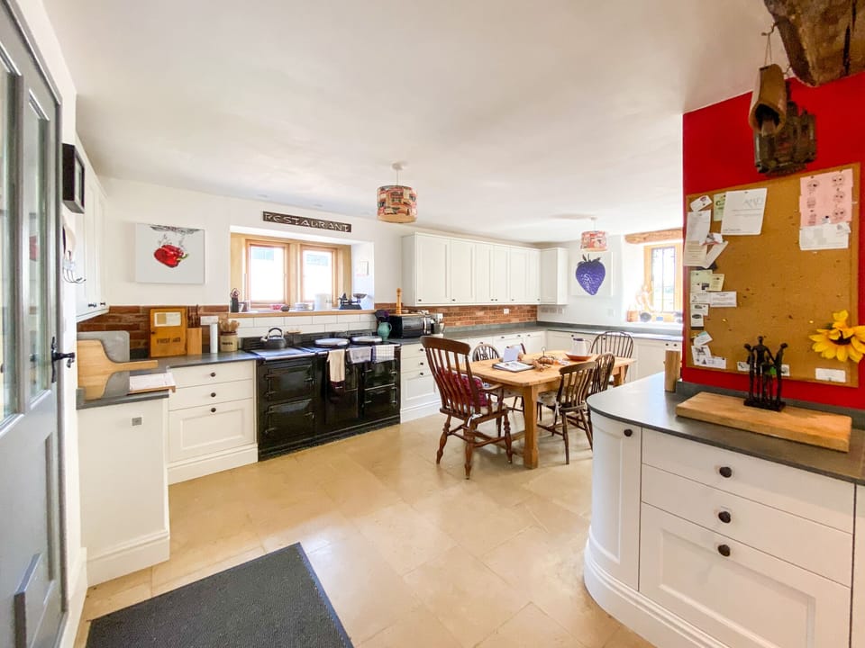 The kitchen  - side table in dining room can extend this table for large  meals