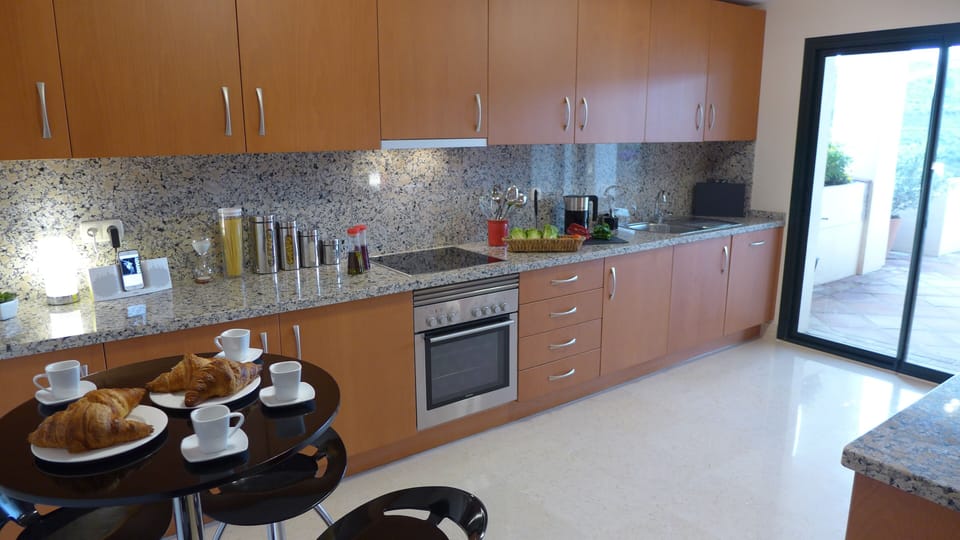 Fully equipped kitchen.  Separate washer and dryer in cupboard on terrace 