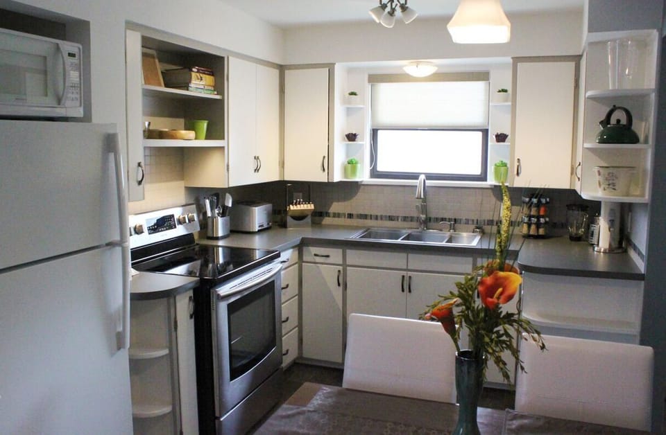 Full kitchen with modern appliances and plenty of cupboard and counter space