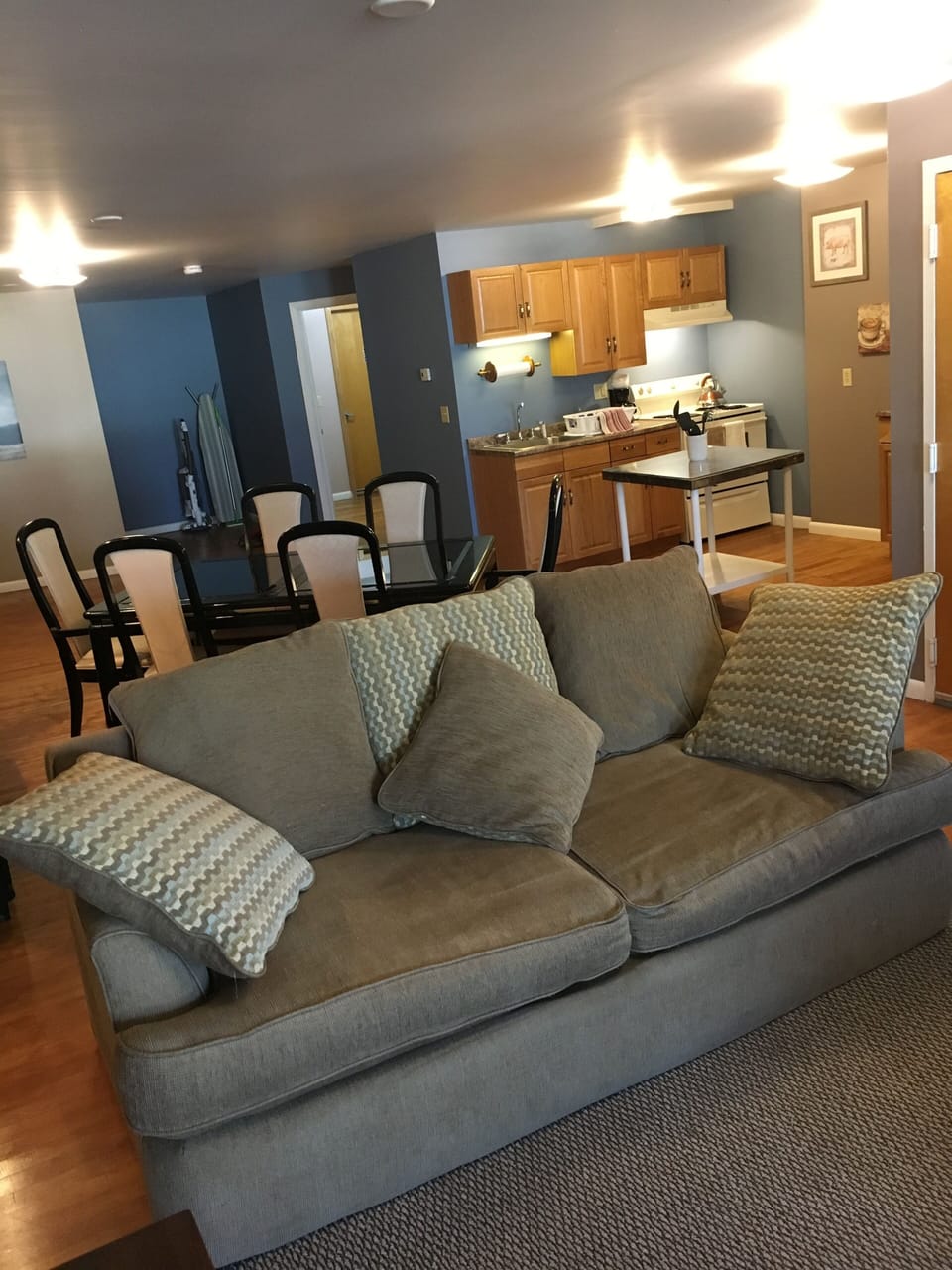 Large comfortable couch can double as another bed for one.