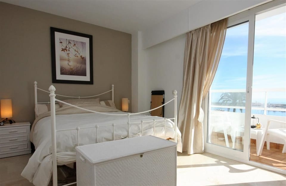 Master bedroom with en-suite bathroom and terrace with sea views