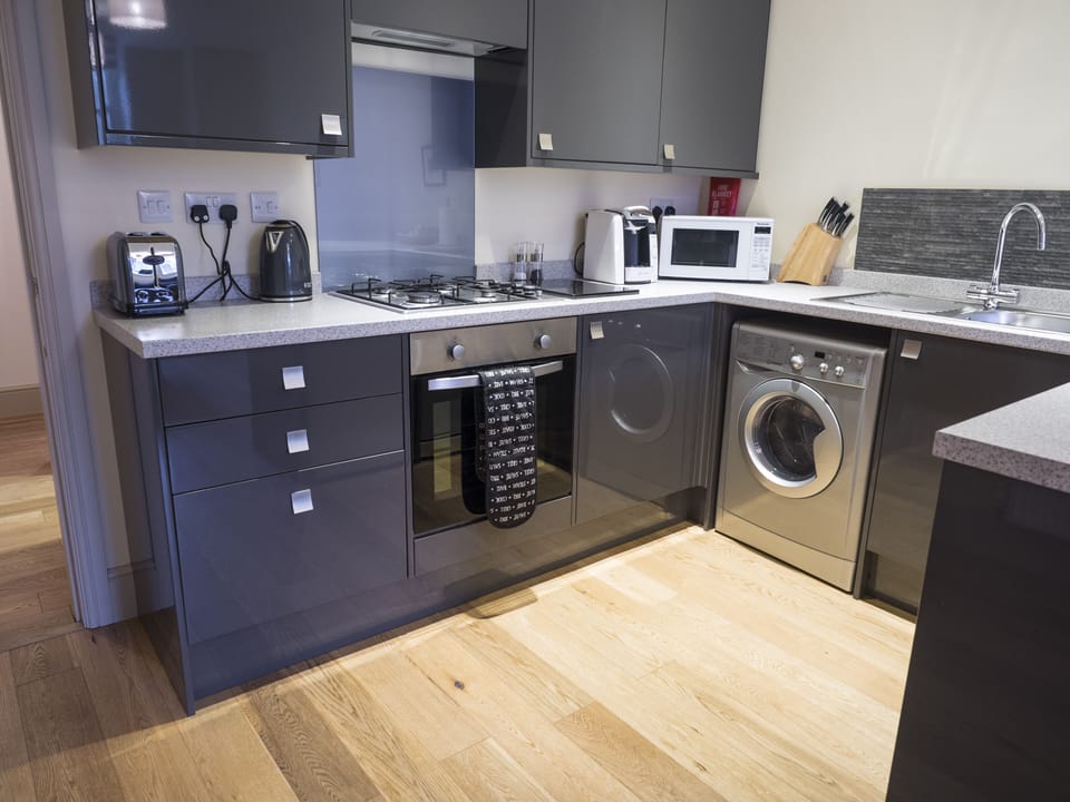 The kitchen complete with everything needed to prepare, cook and serve a meal.