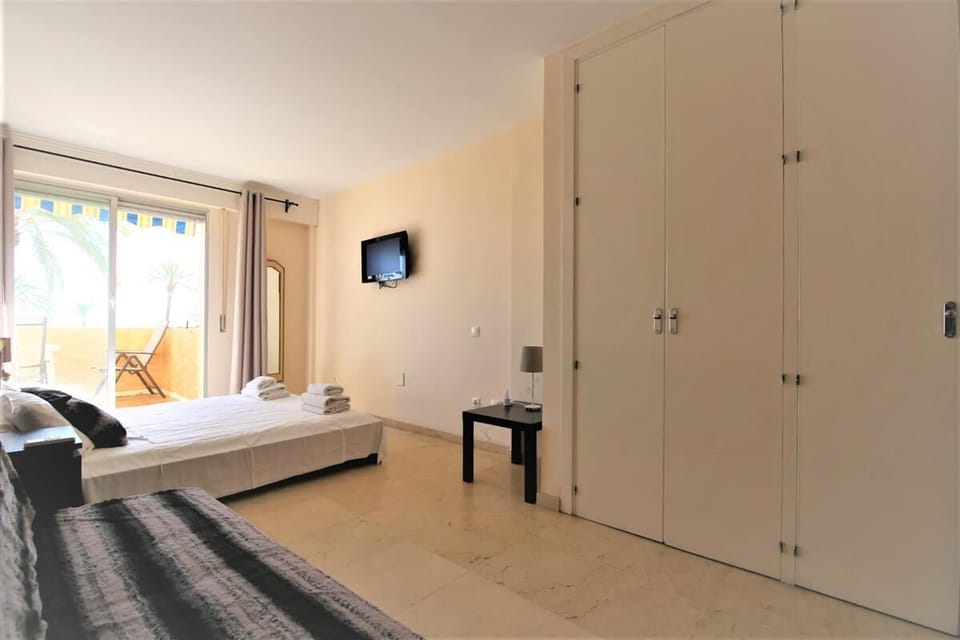 Master bedroom with lots of storage space in its built-in wardrobes (TV not available)