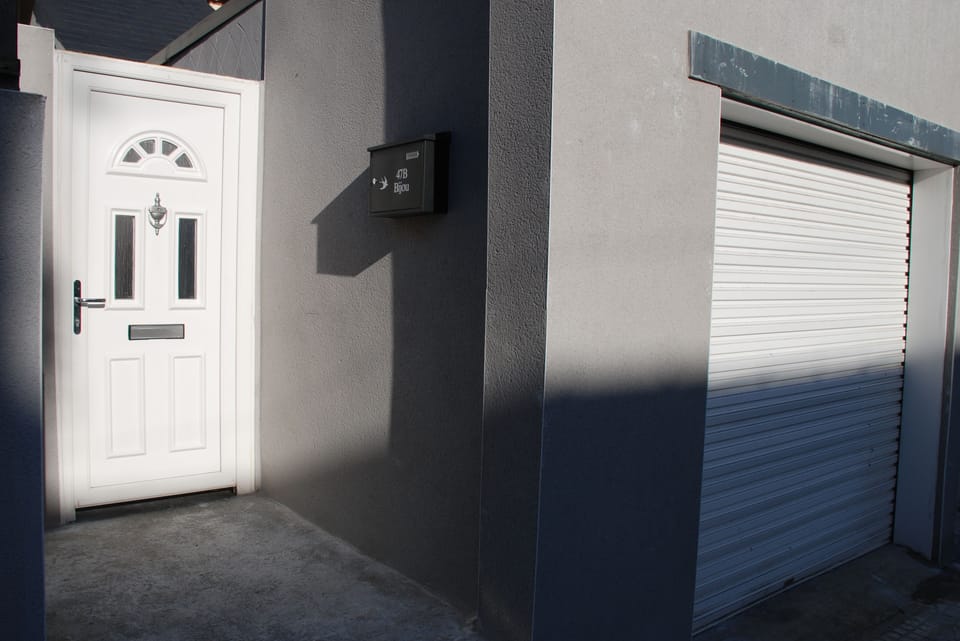 Entrance and private garage at Apartment Bijou