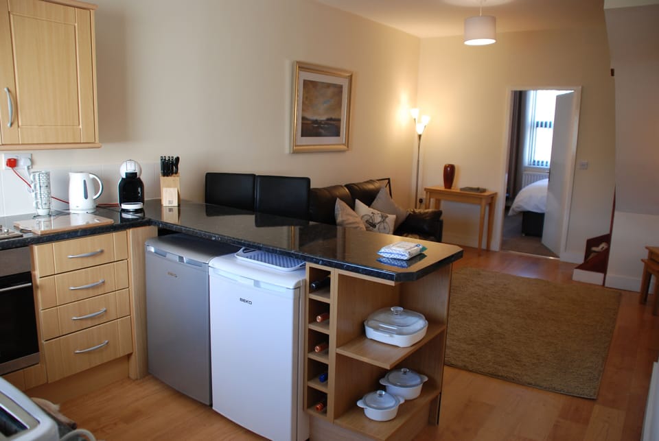 Looking over the breakfast bar to the lounge.
