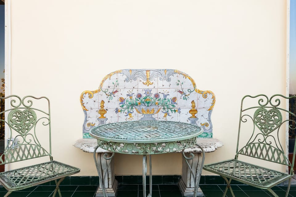 Typical Vietri tiles. Wrought-iron table and chairs.