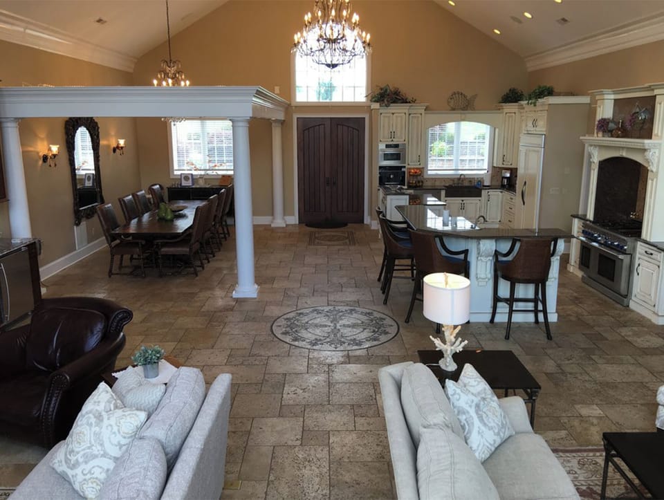 Upstairs great room as viewed from door to veranda. Dining and TV areas on left.