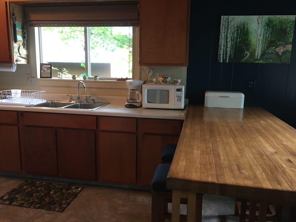 Kitchen with all necessary supplies provided/Double sink/Garbage disposal