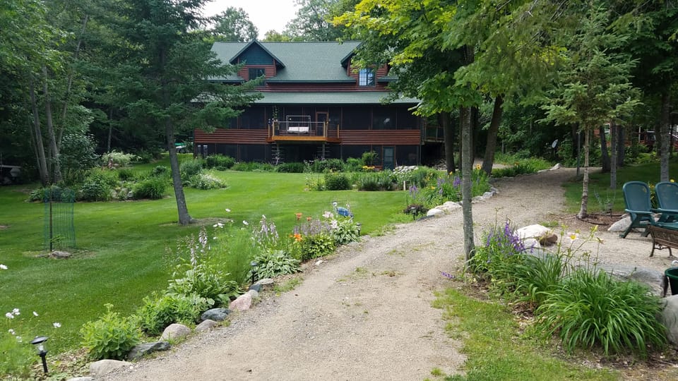 Landscaping, gradual path from lake to front of cabin, fire pit near lake.  