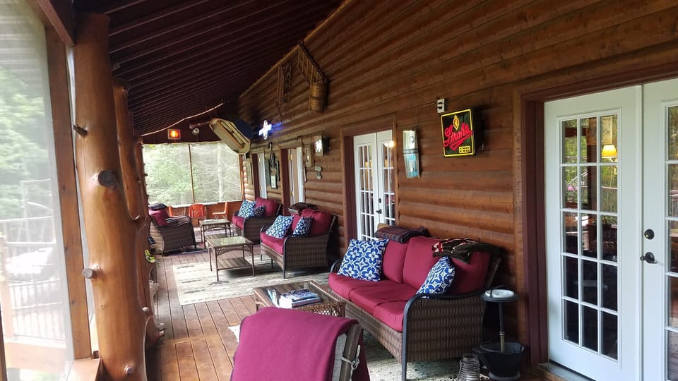 Main level 60' long screen porch (Lower Level also has Screen Porch).  