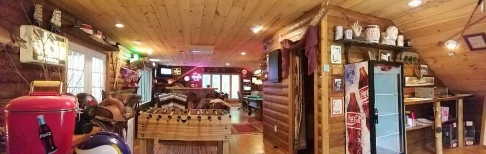 Coke cooler, pizza maker, foosball, poker, and pool table.