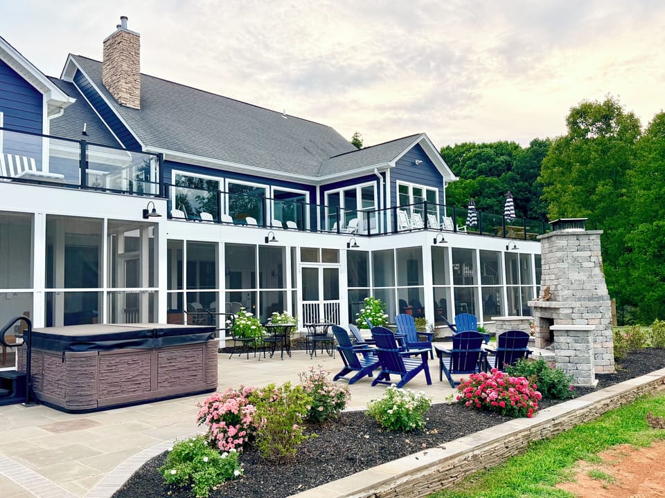 Over 8k sqft of outdoor living: deck, screen porch, two patios, and boathouse