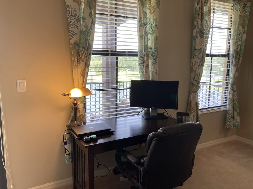 Office area including  computer screen ready to be attached to your computer.