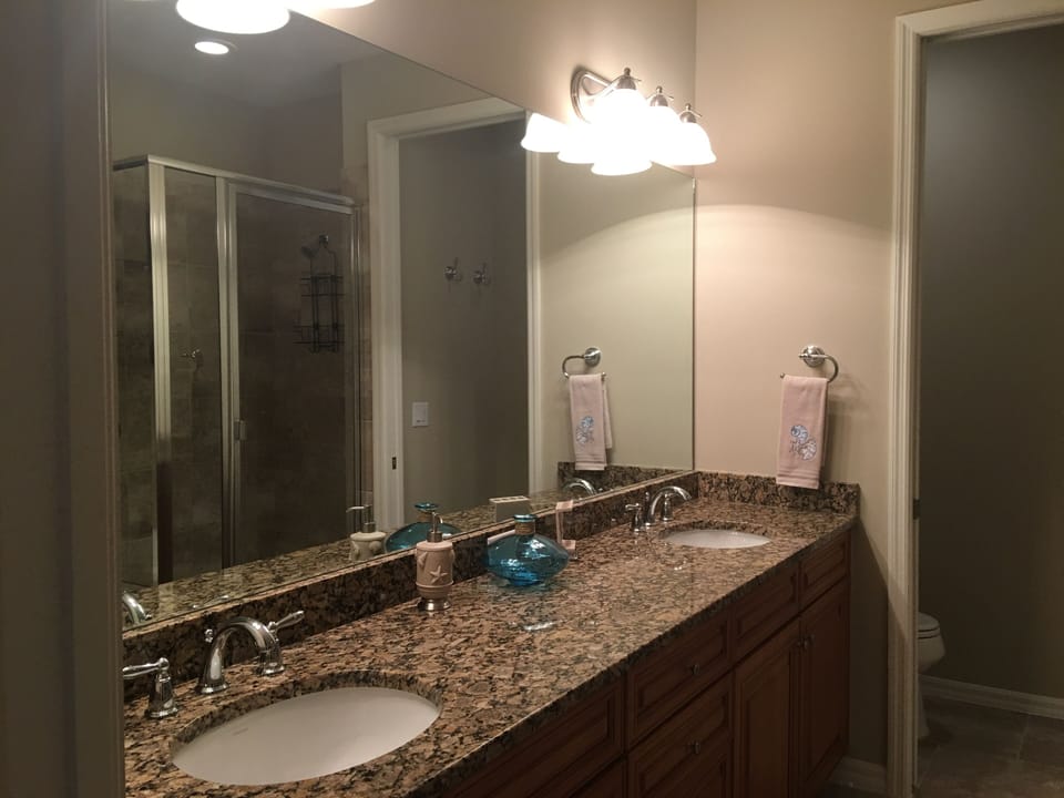 Master bathroom  with his and her sinks