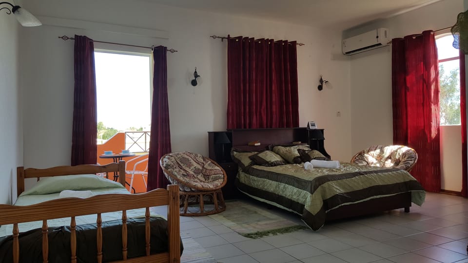 A/c bedroom with a double and single bed