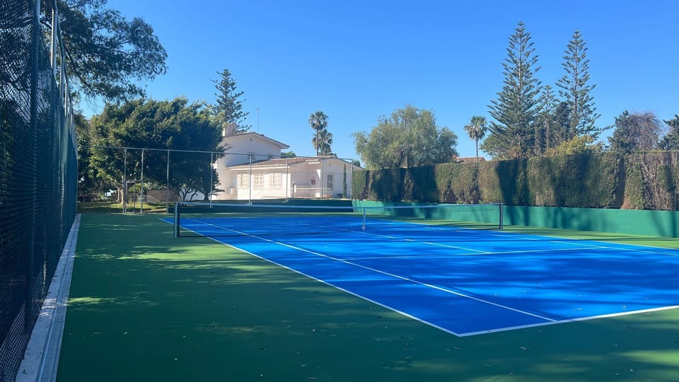 tennis court with view to house
