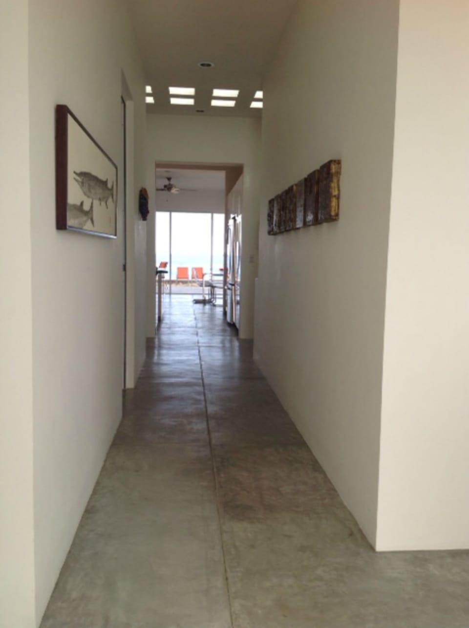 Art filled hallway-view straight through to the ocean!