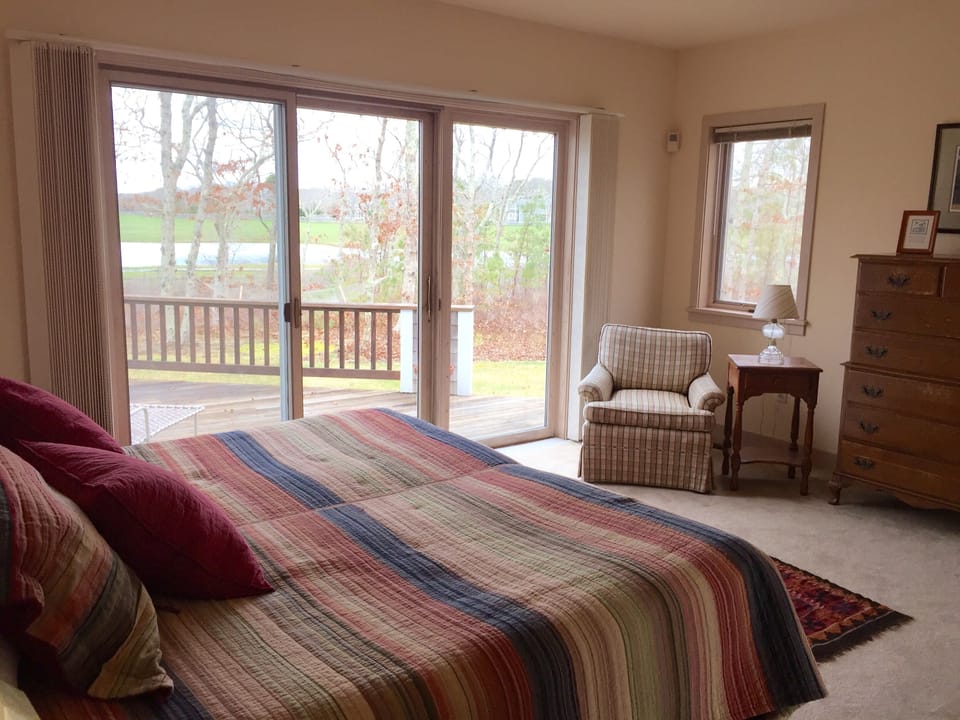 Ground floor primary - Deck access to outdoor shower and full bath to the right