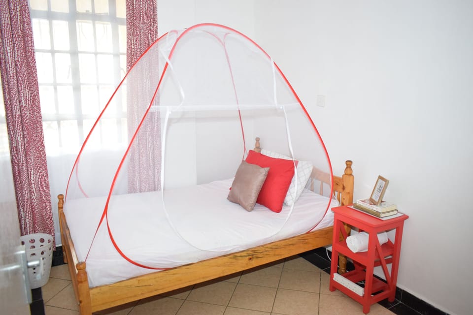 Comfortable Double Bed 1 with fibre pillows.