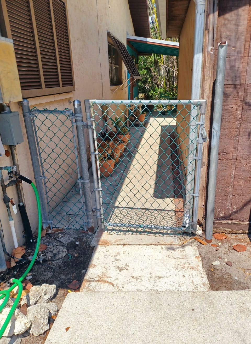 Gate from parking area to patio and apartment
