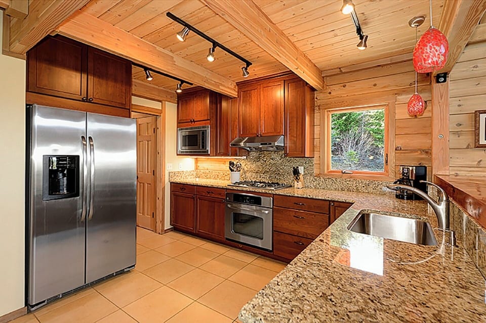 Kitchen Leads To Big Laundry Room and Storage Room & Back Deck