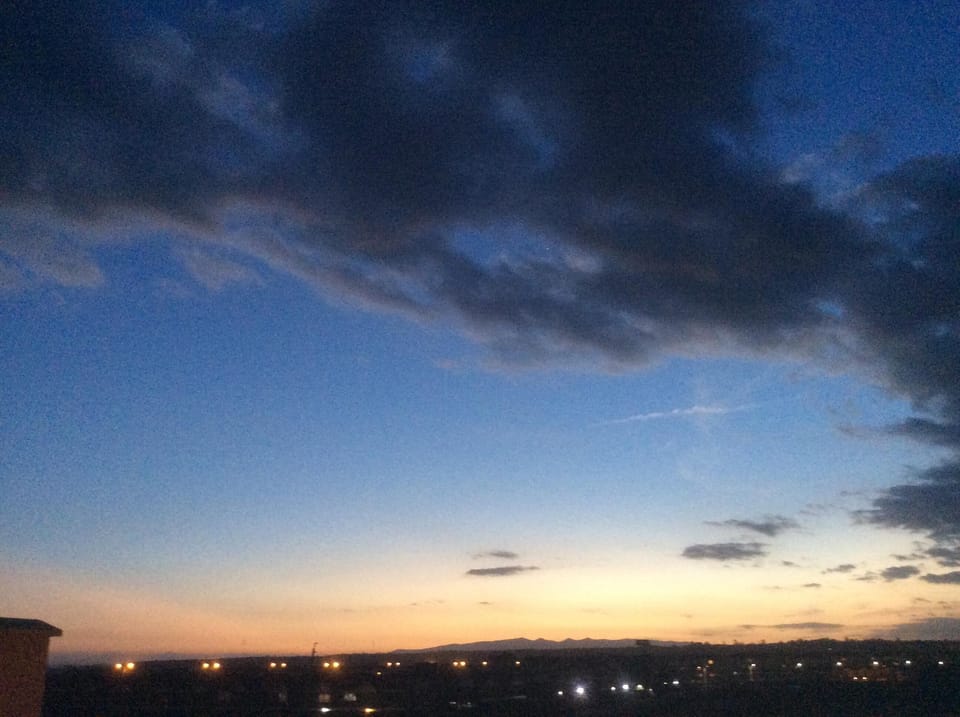 Rooftop views as sun sets behind distant Ngong Hills. Candlelight dinner anyone?
